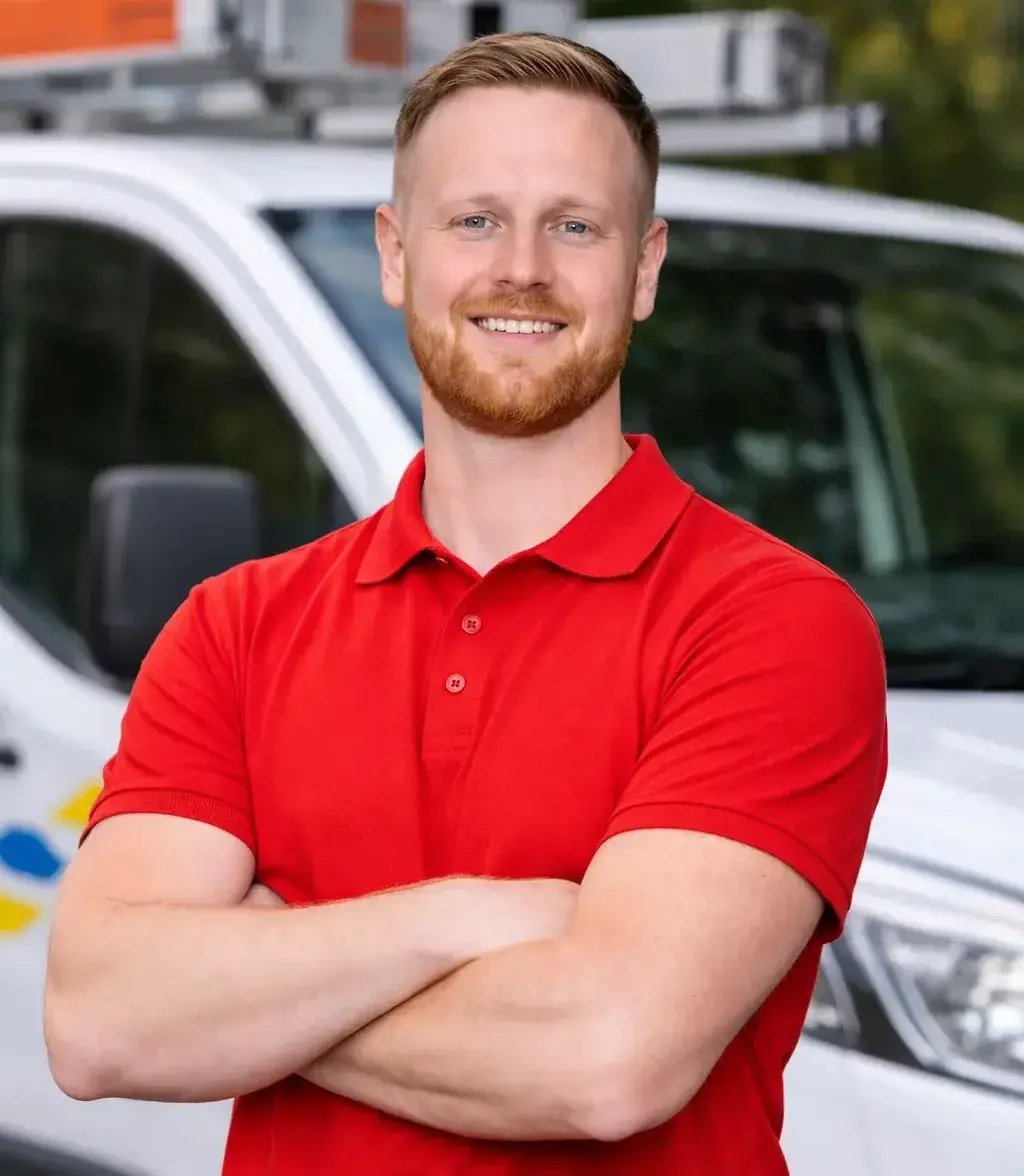 Man in red polo shirt by van-1