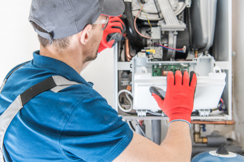 Engineer repairing a boiler